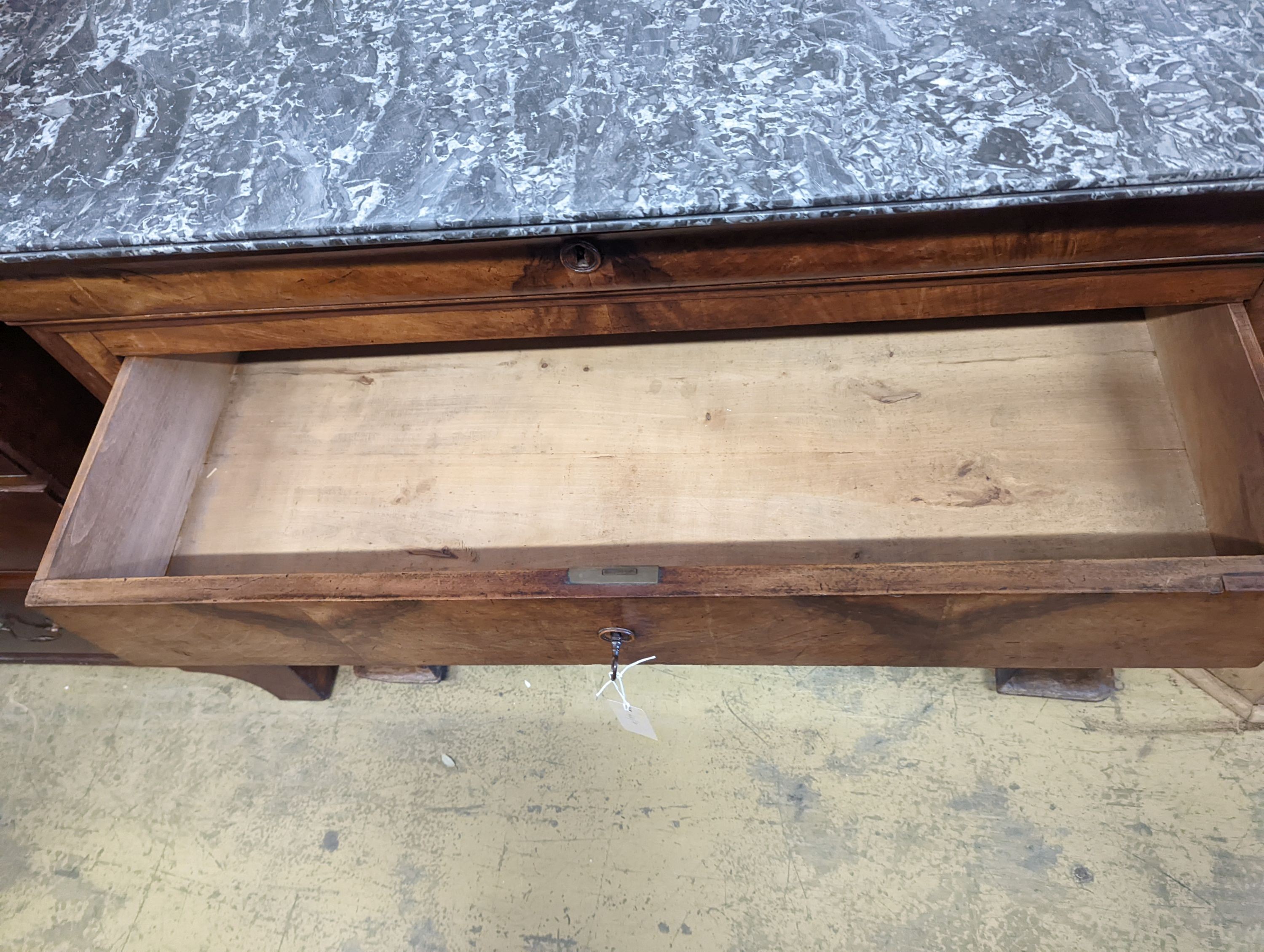 A 19th century French walnut marble topped commode, width 131cm, depth 61cm, height 103cm